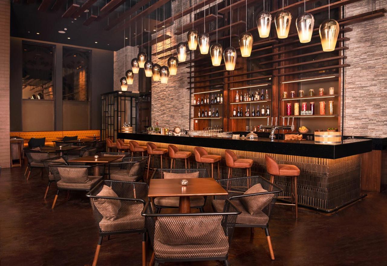 Al Jaddaf Rotana Suite Hotel Dubai Esterno foto The bar at the hotel